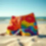 Colorful boardshorts displayed on a sandy beach