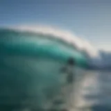 Surf instructor guiding a student on wave riding techniques in the ocean.