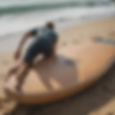 Packing a Surfboard for Safe Transport A surfboard being securely packed into a coffin bag for travel.
