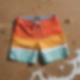 Stylish lightweight board shorts displayed on a beach