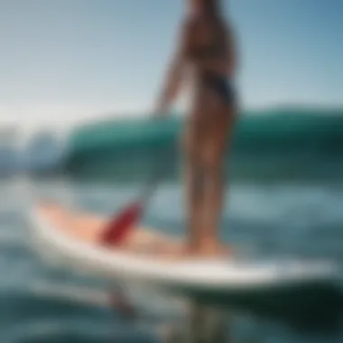 Paddle Technique Analysis on SUP An athlete demonstrating proper paddle technique on a SUP board.