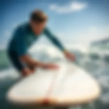 Applying New Wax A surfer applying new wax to a clean surfboard