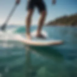 Stylish electric surfboard gliding on crystal clear water