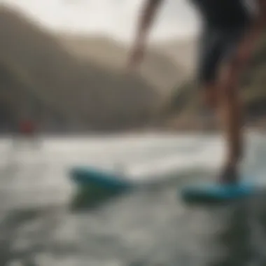 Surfer using Dakine Contour footstraps on the water