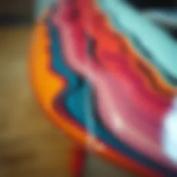 A close-up view of an epoxy surfboard showcasing its sleek design and vibrant colors.