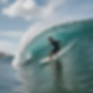 Surfer utilizing an electronic shark deterrent while riding a wave