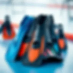 Different types of swimming fins displayed on a surface