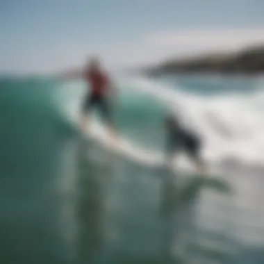 Instructor guiding a beginner surfer