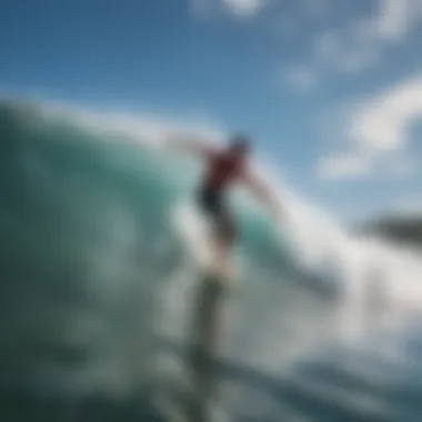 Surfers riding waves at Keiki Beach