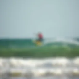 Kiteboarder soaring above the waves