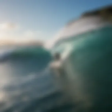 A surfer catching a wave at Poipu Beach