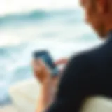 A surfer checking wave conditions on a smartphone app