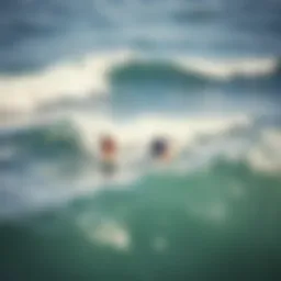 Aerial view of surfers catching waves in Tel Aviv