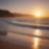 A picturesque view of Taghazout beach with surfers catching waves at sunset