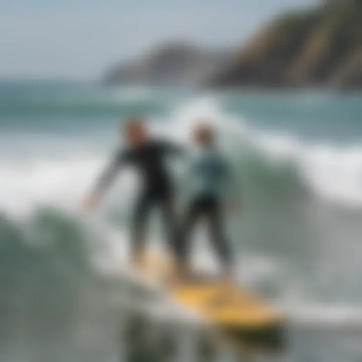 A professional instructor guiding a student in the water during a surfing lesson