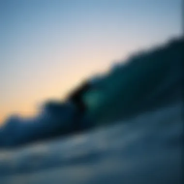Silhouette of a surfer riding a wave at sunset