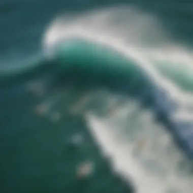 An aerial view of surfers riding waves with different types of boards