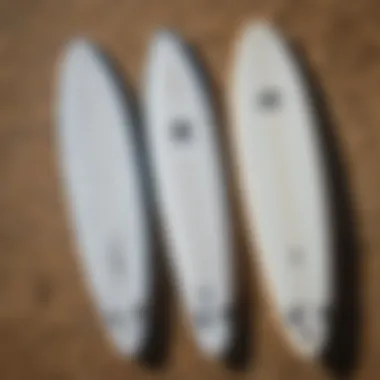 Side-by-side comparison of hydro foil board and traditional surfboard highlighting differences in structure