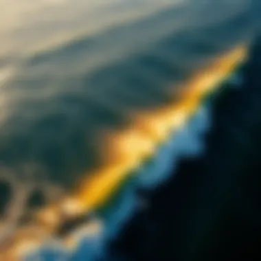 Stunning aerial view of surfers riding waves at sunrise