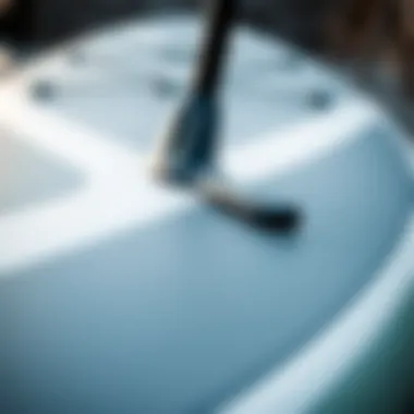 Close-up view of the paddle board's design features showcasing its streamlined shape and material texture
