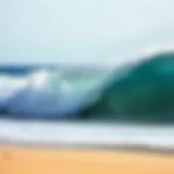 A breathtaking view of barreling waves crashing onto a sandy shore.