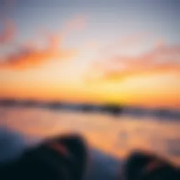 A breathtaking view of surfers riding the waves at sunset in San Diego