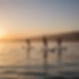 Vibrant paddleboarders gliding over calm waters at sunrise