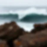 A breathtaking view of Mavericks waves crashing against the rocky coastline