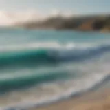 A stunning view of the Aruba coastline with surfers riding the waves