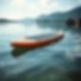 A vibrant small SUP board on a picturesque lake