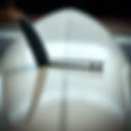 A close-up view of a high-performance surfboard showcasing its design and materials