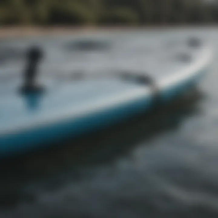 Close-up of a paddleboard secured in the Thule rack with safety features visible