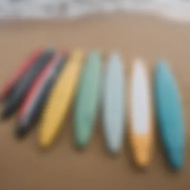 A variety of Torq Surfboards displayed on the beach