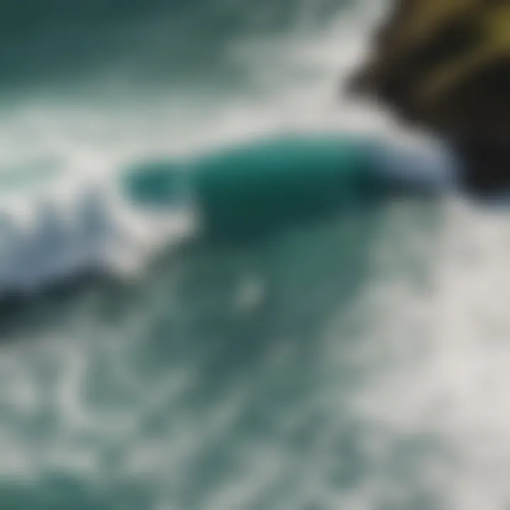 An aerial view of surfers riding waves at a famous surf spot