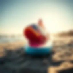 A vibrant fish surfboard on a sunny beach