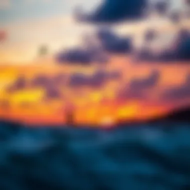 A vibrant sunset casting colors over kitesurfing spots on Sicily's coastline