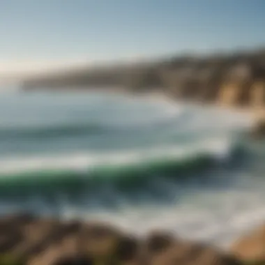 Scenic view of La Jolla coastline with surfers