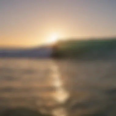 Surfers catching waves at sunrise at La Ventana