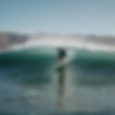 Surfer riding a wave at Los Barriles