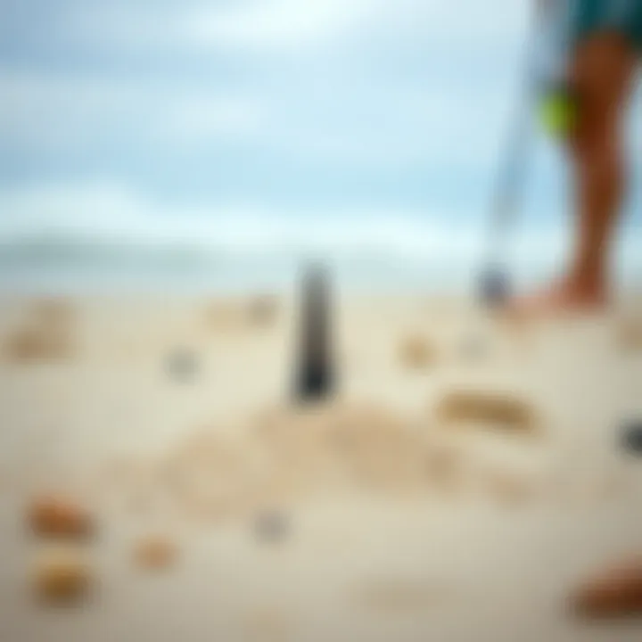 A detailed view of a sand spike set up on a beach, ready for surf fishing.