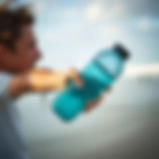 Surfer holding a reusable water bottle on the beach