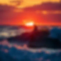 Surfer riding a wave with a vibrant sunset in the background