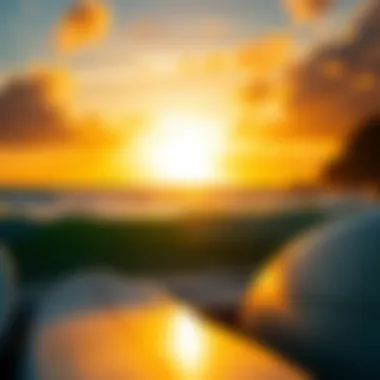 A stunning sunset view over the ocean with surfboards in the foreground