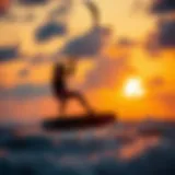 Dynamic kitesurfing maneuver captured against a stunning sunset.