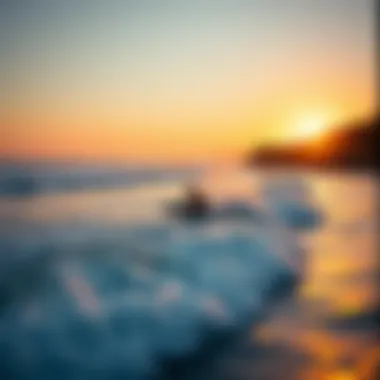 A surfer riding a wave at Pismo Beach during sunset