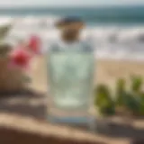 A bottle of Pure Grace summer surf perfume on a beachside table