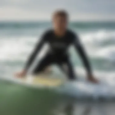 An experienced instructor demonstrating surf techniques to students.