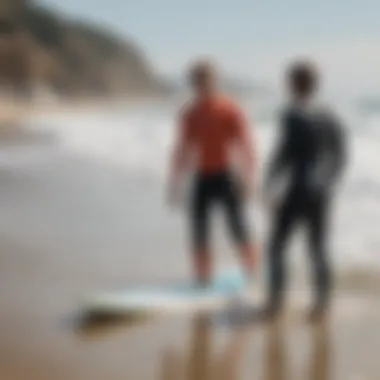 Surf Instructors Teaching Techniques Instructors guiding students in surf techniques on the sand