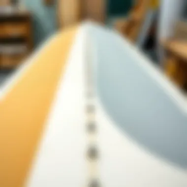 Different grades of sandpaper laid out for surfboard finishing