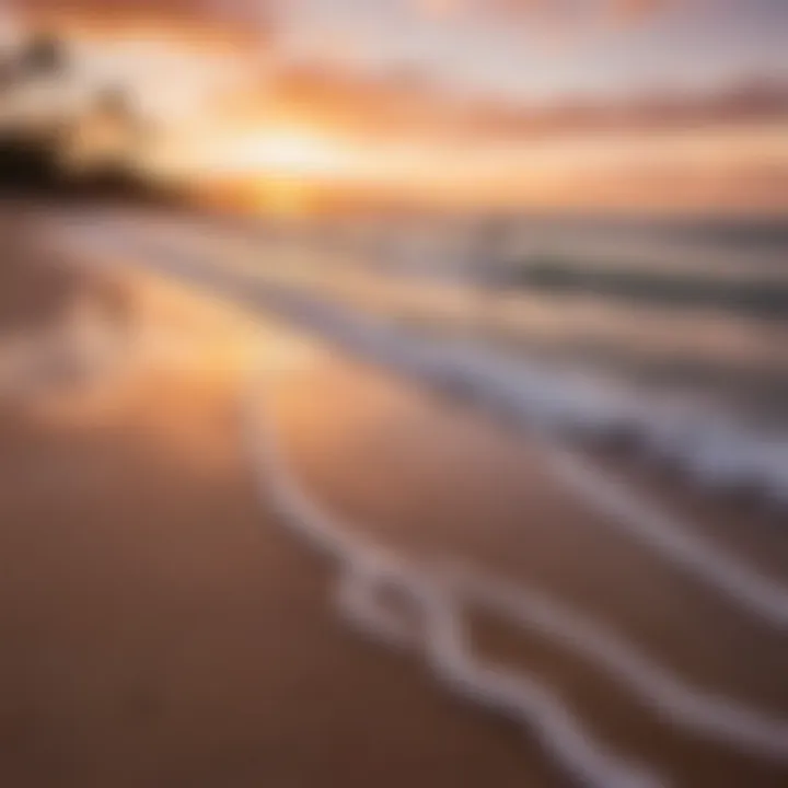 A vibrant sunset over Kihei beach with surfers in the distance